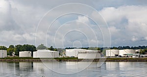 Old White Tanks on Shore