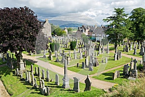 Old white tombstones in a cemetery