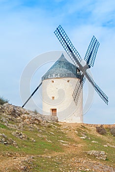 Old white traditional windmill on the hill near Consuegra Casti
