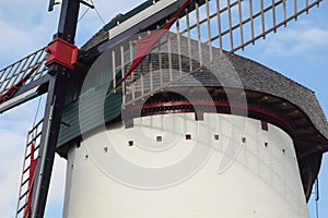 Renovated old white windmill