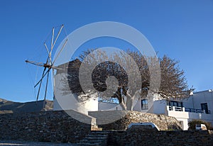 Old white windmill at sunset in Parikia on Paros Island, Cyclades, Greece