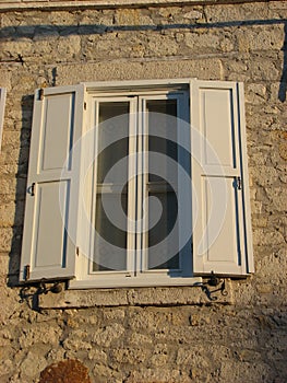 Old white window with shutters