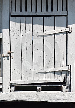 Old white wooden barn door