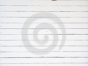 Old white wooden planks background. Texture of old boards with peeling paint