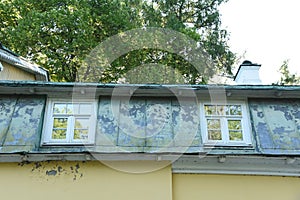 Old white wooden window with layout and rebate roof photo
