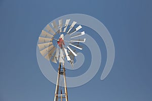 Old windmill against blue sky in Paralimni, Cyprus photo