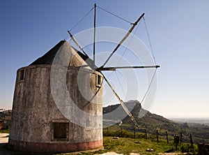 Old Windmill against Palmela photo