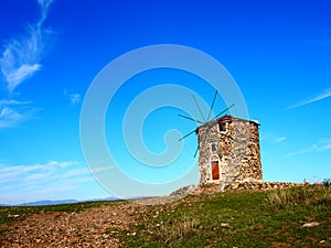 Old stone windmill in Cunda, Alibey island, AyvalÃÂ±k BalÃÂ±kesir, Turkey photo