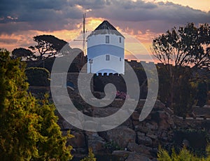 Old windmill in Chora Mykonos Greece at sunset