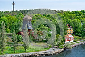 Old windmill on Djurgarden island, Stockholm, Sweden photo