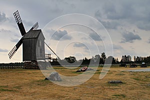 Old windmill facing thunder