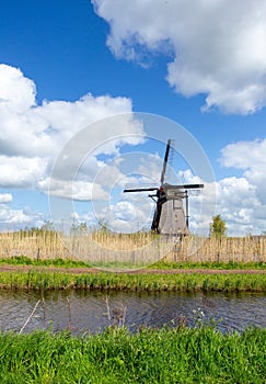 Old windmill in Kinderdijk, part of the world heritage