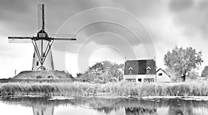 Old windmill landscape canal mill clouds
