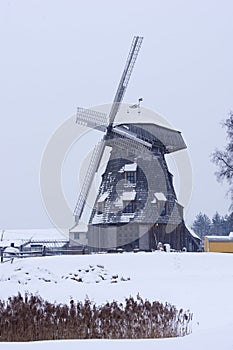 Old windmill landscape in winter