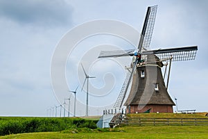 Old windmill and new wind turbines