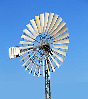 Old Windmill on a pylon with a lot of wings