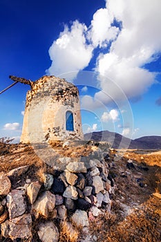 Old windmill ruins on a hill in Santorini island
