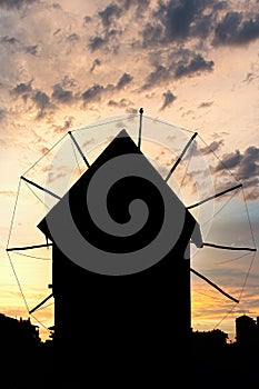 Old windmill silhouette in Nessebar sunset