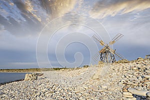 Old windmill on stoney beach