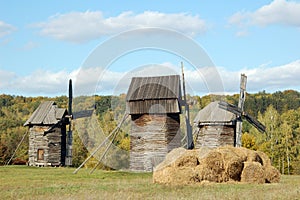 Old windmill and straw roll