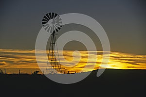 Old windmill at sunset