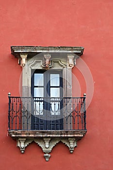 Old window with a balcony photo