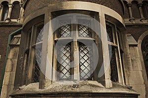 Old window on the brick wall of cathedral in Lviv