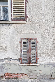 Old window with closed wooden shutters, Germany