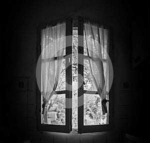Old window in a dark room