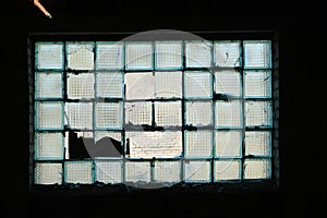 Old window of glass blocks in an abandoned building