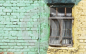 Old window and green wall with space for text