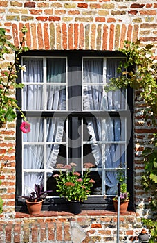 Old window of a house in Brugge, Belgium