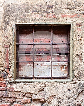 Old window with iron gratings