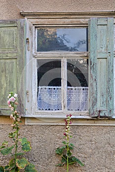 Old window with open shutters