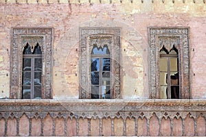 Old window in palace on Piazza Sordello the historic city center of  Mantua, Italy