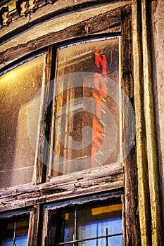 Old window with reflective inscription Hotel