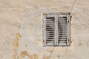 Old window with a shutter