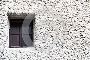 Old window and stone wall