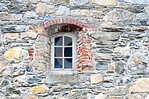 Old window and stone wall