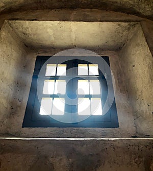 Old window with streaming light