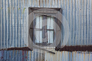 Old window in  typical construction in the town of Puerto Piramides, Peninsula Valdes, Chubut Province, photo