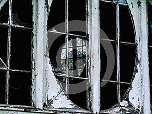 Old window on white from without abandoned building