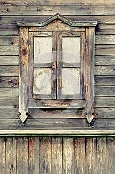 Old window in a wooden house