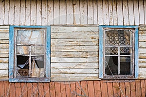 Old window of wooden house in Chernobyl exclusion zone