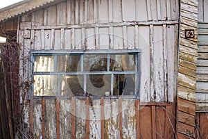 Old window of wooden house in Chernobyl exclusion zone