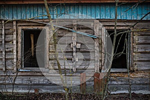 Old window of wooden house in Chernobyl exclusion zone