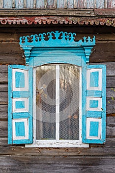 Old window of wooden house in Chernobyl exclusion zone