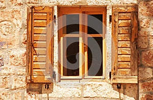 Old window with wooden shutter