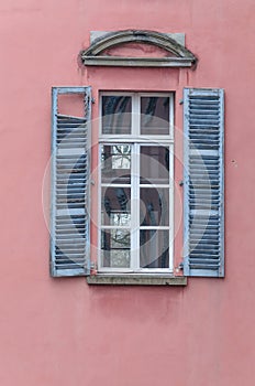 Old window with wooden shutters