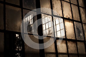 Old windows in abandoned warehouse